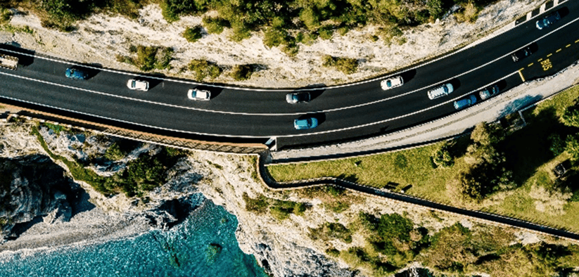 Cars Near Cliff with Water